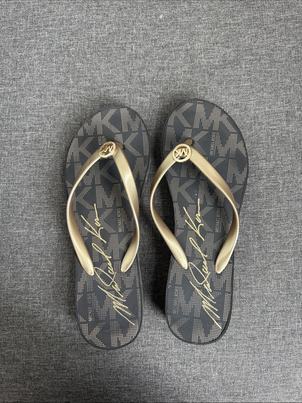 Michael Kors Black and Gold Logo Flip Flop Sandals